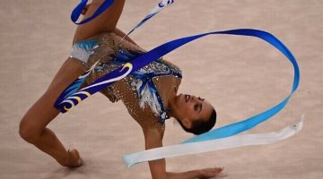 Israel's Linoy Ashram competes in the individual all-around final of the Rhythmic Gymnastics event during Tokyo 2020 Olympic Games at Ariake Gymnastics centre in Tokyo, on August 7, 2021. (Photo by Martin BUREAU / AFP)