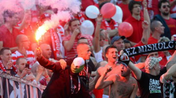 Fans of VTK Diosgyor light flares during the Hungarian Cup final football match VTK Disosgyor vs TE Ujpest on May 25, 2014 at the Puskas stadium in Budapest.  AFP PHOTO / ATTILA KISBENEDEK (Photo by ATTILA KISBENEDEK / AFP)