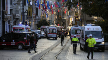 Police vehicles and ambulances are parked at the site of an explosion on Istanbul's popular pedestrian Istiklal Avenue in Istanbul, Turkey, Sunday, Nov. 13, 2022. Istanbul Gov. Ali Yerlikaya tweeted that the explosion occurred at about 4:20 p.m. (1320 GMT) and that there were deaths and injuries, but he did not say how many. The cause of the explosion was not clear. (AP Photo/Francisco Seco)