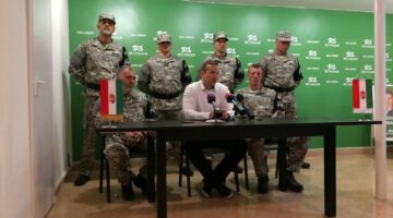 Laszlo Toroczkai, first row center, head of Hungary's far-right Our Homeland Movement, announces the formation of the National Legion, a "self-defense group" created in the spirit of the Hungarian Guard, which was disbanded by the courts in 2009 in Budapest, Hungary, Tuesday, May 14, 2019. The group's main activities will include "guarding of traditions" and teaching basic military skills. (AP Photo/Pablo Gorondi)