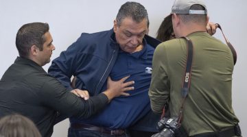 U.S. Sen. Alex Padilla, D-Calif., is pushed out of the room as Homeland Security Secretary Kristi Noem holds a news conference regarding the recent protests in Los Angeles, Thursday, June 12, 2025. (David Crane/The Orange County Register via AP)