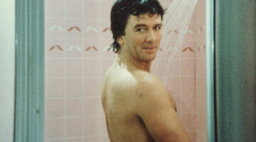 In a scene from the American television series 'Dallas,' American actor Patrick Duffy (as Bobby Ewing) stands in the shower and looks over his shoulder in an episode called 'Blast From the Past,' May 1986. (Photo by CBS Photo Archive/Getty Images)