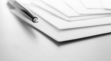 envelopes and ball pen on a table and a place for your text