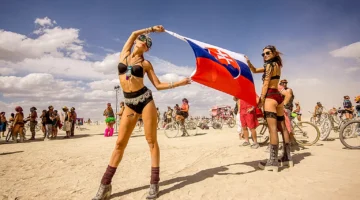 burning-man-women-holding-slovakia-flag-21635218606