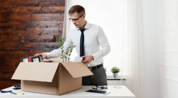 Successful businessman moving into a new office