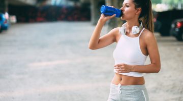 portrait of woman taking break from jogging