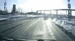 russia-dashboard-cam-tank-drives-across-road-snow-1359329911C-animated