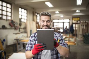 creative worker carpenter looking for new ideas in workshop.